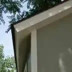 Installed Meridian 8 ft. x 10 ft. Wood Storage Shed with Autumn Brown Shingles - Image 5